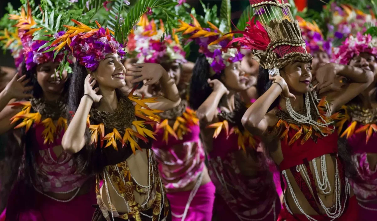 Female dancers performing traditional Polynesian dances during the Heiva event in Papeete, Tahiti.